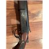 Image 5 : Cooey  model 34 single barrel shotgun featuring a wooden stock and blued metal receiver. The receive