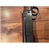 Image 6 : Cooey  model 34 single barrel shotgun featuring a wooden stock and blued metal receiver. The receive