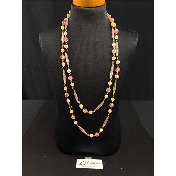 A Double Strand Necklace Featuring Pink and Yellow Lucite Beads on a Gold Tone Chain