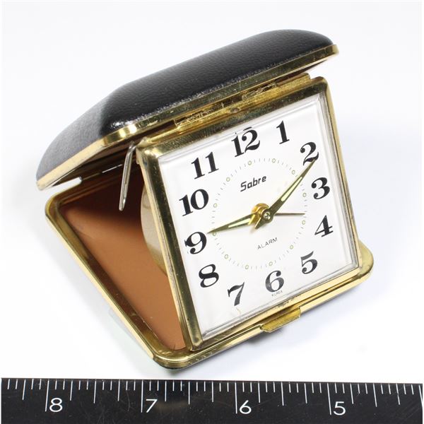 VINTAGE SABRE BRAND TRAVEL ALARM CLOCK IN A FOLD