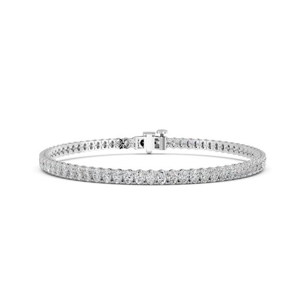 1 CTTW Oval Lab Grown Diamond Huggie Earrings in 14K White Gold