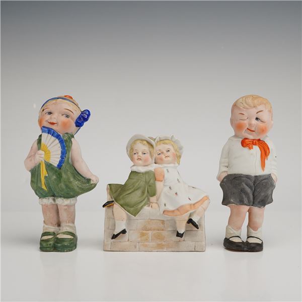 Three Bisque Porcelain Children Figurines