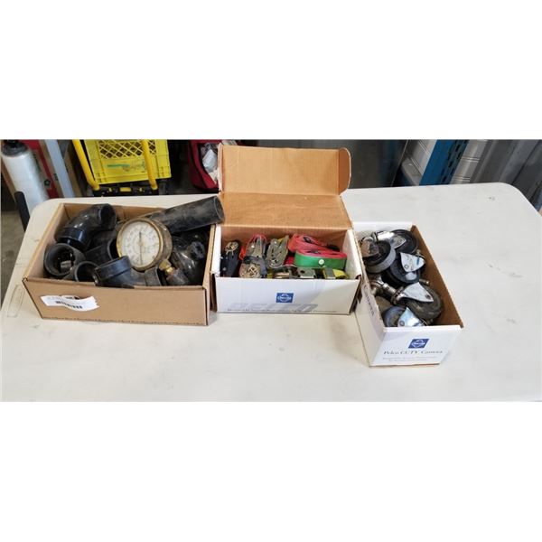 BOX OF CASTERS, LOAD STRAPS, ABS PIPE PIECES, AND VINTAGE GUAGE