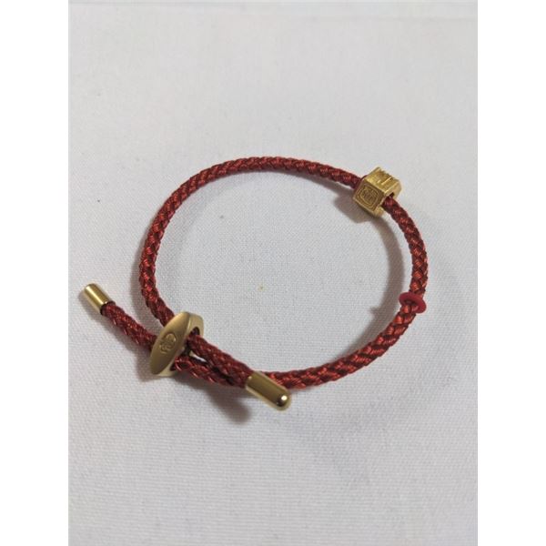 GOLD TONE STRING BRACELET
