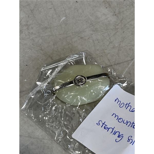 MOTHER OF PEARL PENDANT MOUNTED INTO A STERLING SILVER TENSION