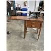 Image 1 : VINTAGE SEWING MACHINE IN TABLE