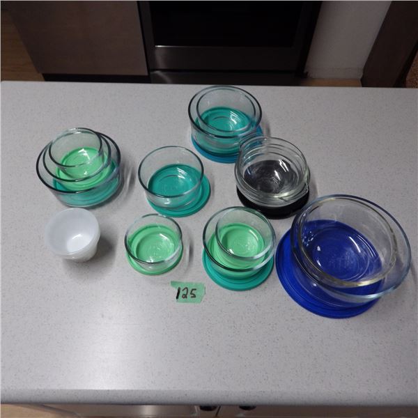 lot of glass storage dishes with lids