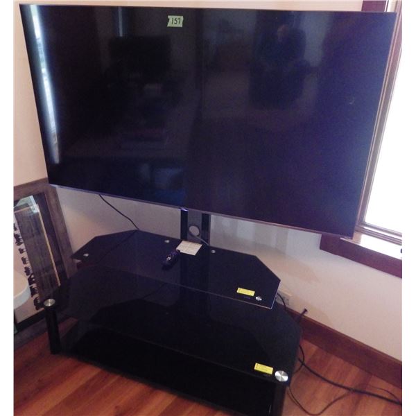 TCL flat screen TV model 65S531-CA with stand