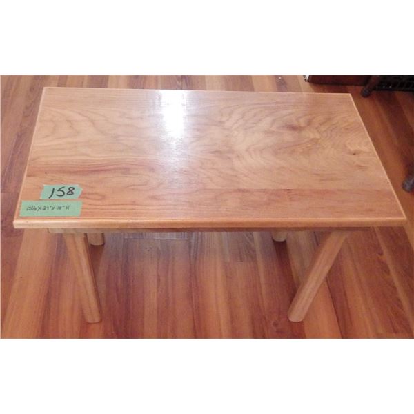 small handcrafted wood table