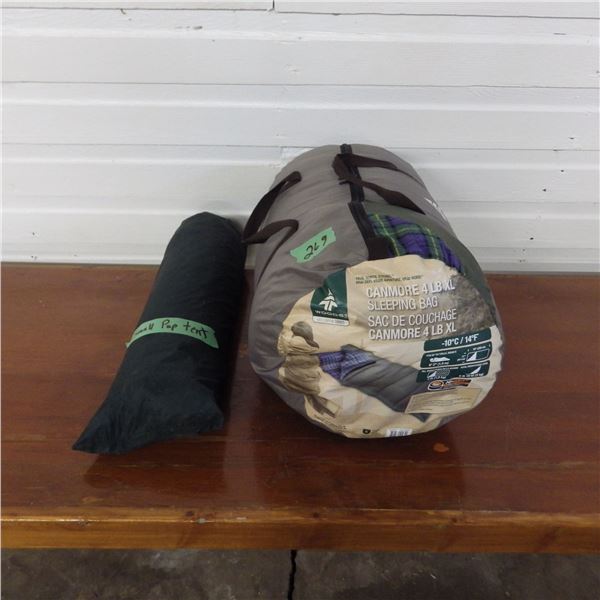 a small pup tent and sleeping bag
