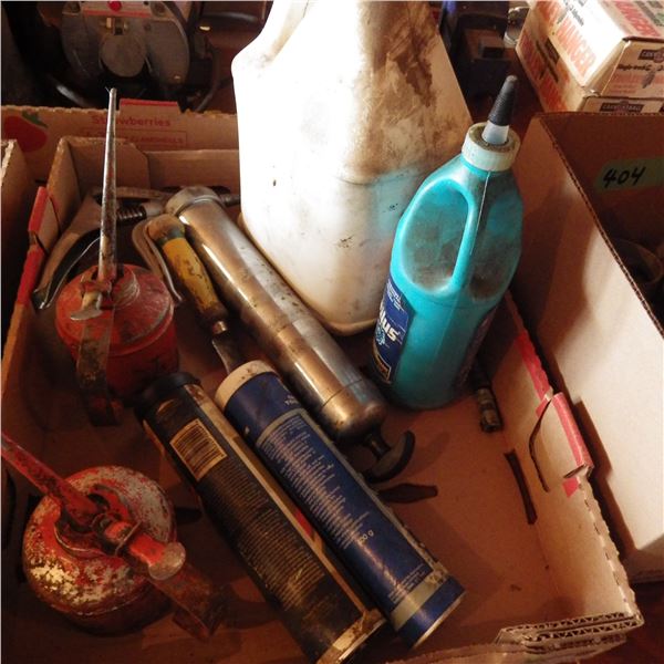 box with grease gun , tubes of grease , oil cans