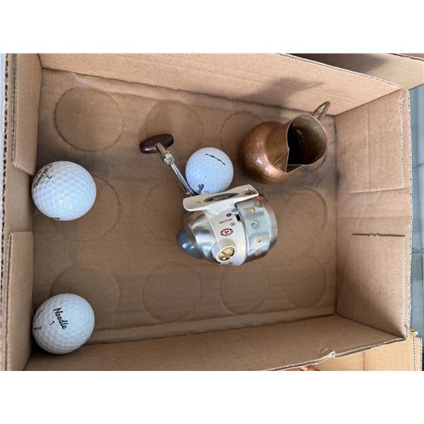 Reel and golf balls, and small pitcher