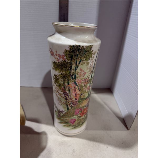 vintage Japanese ceramic vase features a detailed peacock and floral design