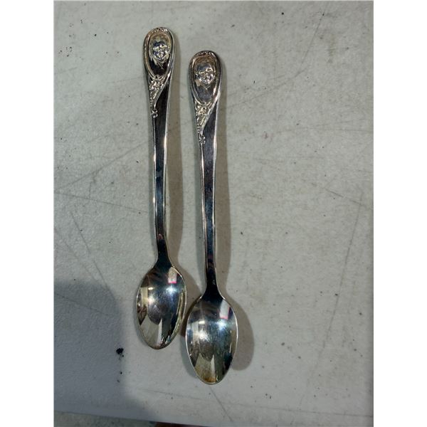 vintage silver-plated Gerber baby spoon featuring the iconic Gerber baby face on the handle.