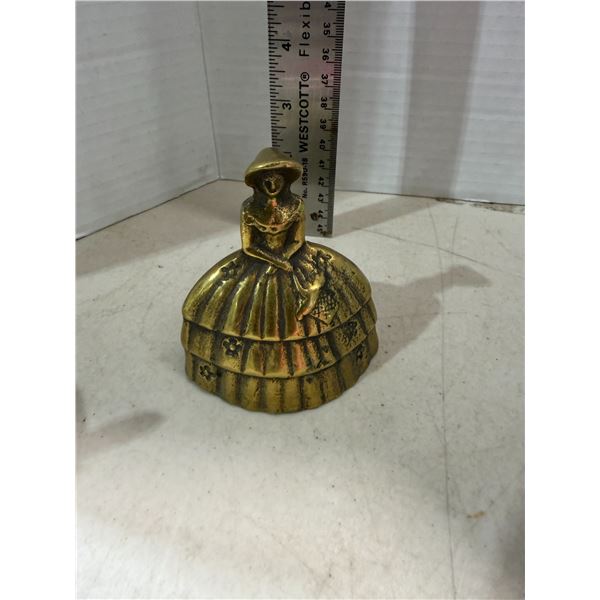 vintage brass bell is designed as a lady in a full-skirted Victorian dress and bonnet