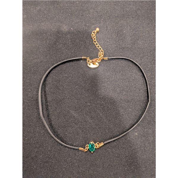 Necklace with emerald pendent