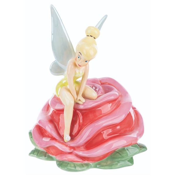 A Tinker Bell on a Rose Cookie Jar.
