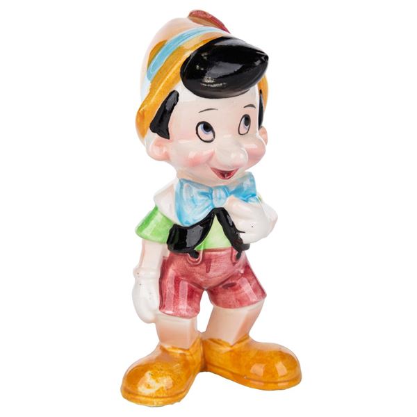 A Ceramic Pinocchio Figurine.