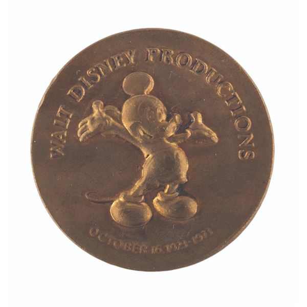 A Walt Disney Productions 50th Anniversary Coin.