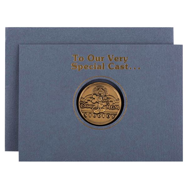 A Disney-MGM Studios Cast Member Grand Opening Coin.