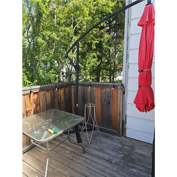 Patio Set With Glass Table and Red Umbrella