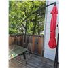 Image 2 : Patio Set With Glass Table and Red Umbrella