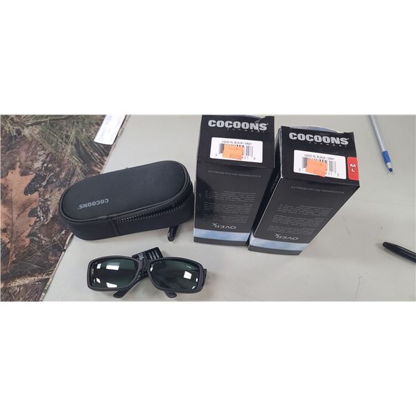 2 PAIRS OF M/L BLACK / GREY COCOONS COVER OVERS FOR EYE WEAR. POLARIZED UV400 FLEX TO FIT