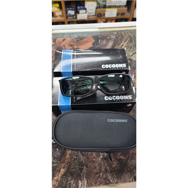 2 PAIRS OF SM/MED BLACK / GREY COCOONS COVER OVERS FOR EYE WEAR. POLARIZED UV400 FLEX TO FIT