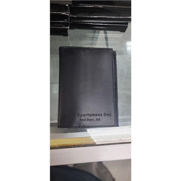 10 LEATHER PASSPORT/HUNTING LICENSE WALLET MARKED WITH THE SPORTSMENS DEN