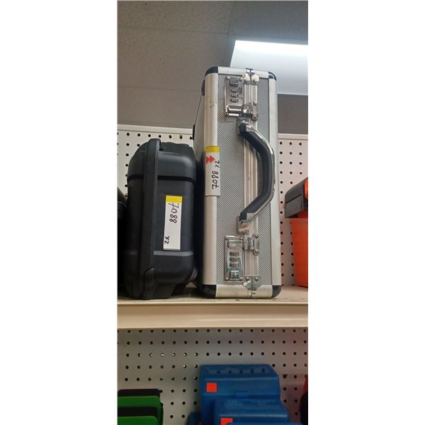 1 NANUK PISTOL CASE MODEL 909 AND 1 ALUMINUM PISTOL CASE WHICH IS A SLIGHTLY USED DEMO