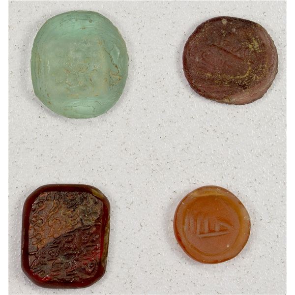 MEDIEVAL ISLAMIC: LOT of 3 glass weights and 1 glass stamp