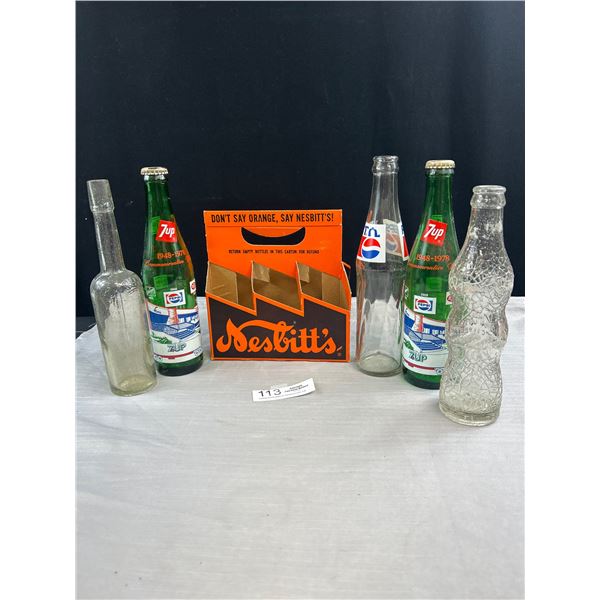 5 Vintage Soda Bottles in a Nesbitt's Soda Carrier, The Lions and 2 1978 7-Up Commemorative Bottles 