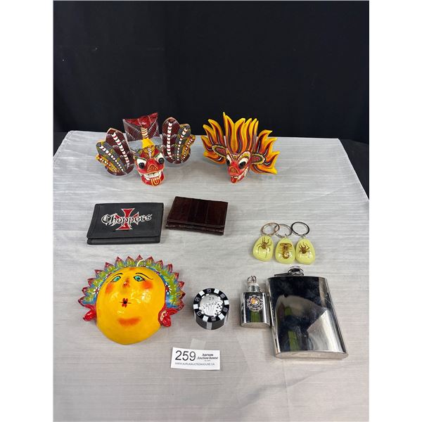A Collectible Lot of Colourful Masks Key Chains Flasks Ets