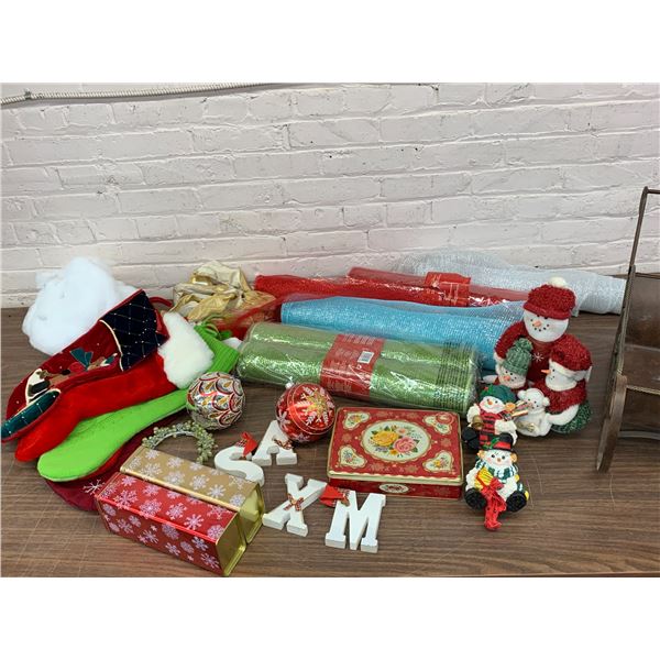 Table of Christmas Items Mesh Wrap, Stockings, Ornaments, Decor, Sleigh, Snowmen