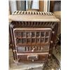 Image 1 : Cast Iron Wood Stove/Furnace with Decorative Detailing