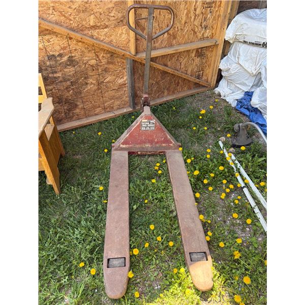 Heavy-Duty Pallet Lifter with Interior Lift Truck Services Label