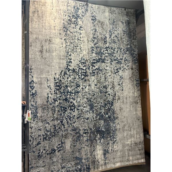 New - Zoe Area Rug - approx. 115in x 76in - MSRP $2,280 - new floor model