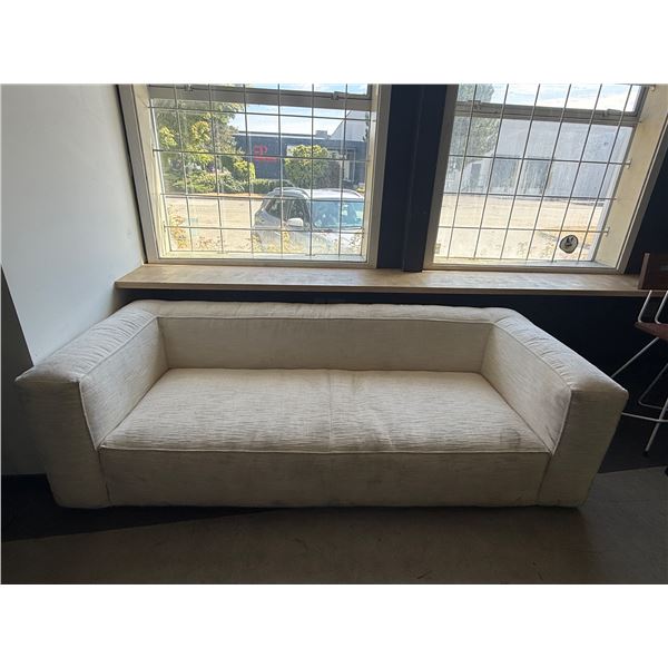 Modern Low Profile Cream Sofa, H25" x W89" x D36" - slightly dusty...