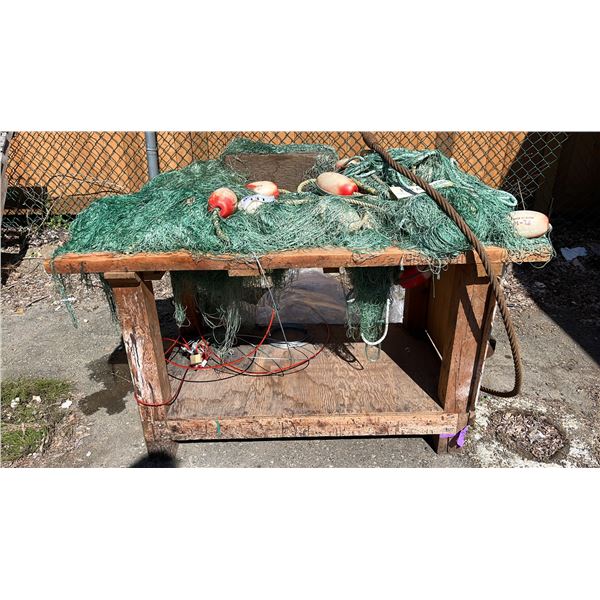 WOODEN TABLE WITH LARGE FISHNET AND LINE FLOATS