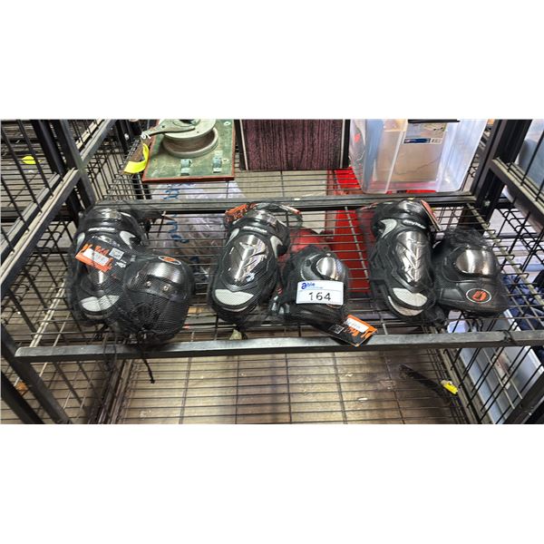 SHELF OF *NEW* RIDING TRIBE FULL KNEE PADS & KNEE/ELBOW PADS