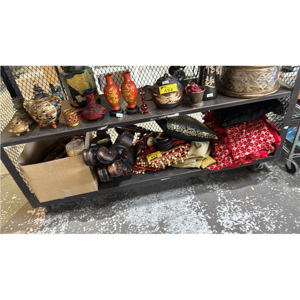 SHELF OF ASSORTED DECOR INCLUDING; BLANKETS, CUSHIONS, SCROLLS, BOOKS & MORE