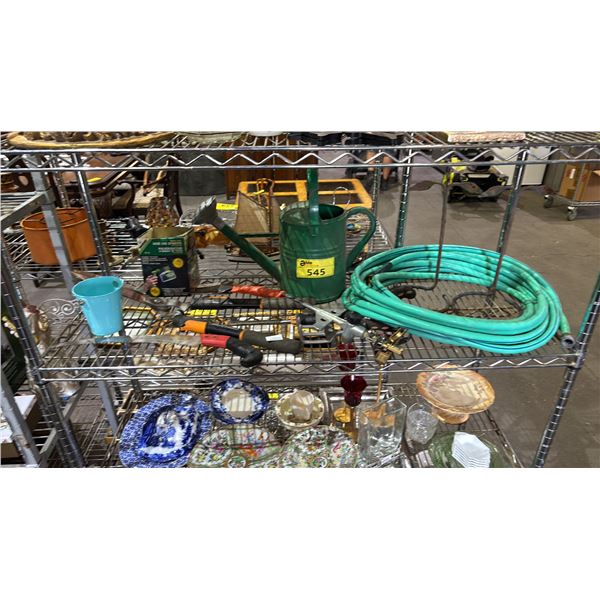 SHELF OF ASSORTED ITEMS INCLUDING; GARDEN HOSE, HOSE END SPRAYER, GARDEN TOOLS & MORE