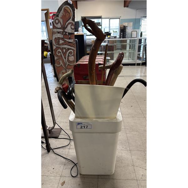 TALL PLASTIC PLANTER CONTAINING ASSORTED WOOD CANES