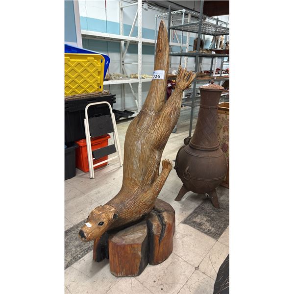 APPROX. 57" TALL WOOD OTTER CARVING