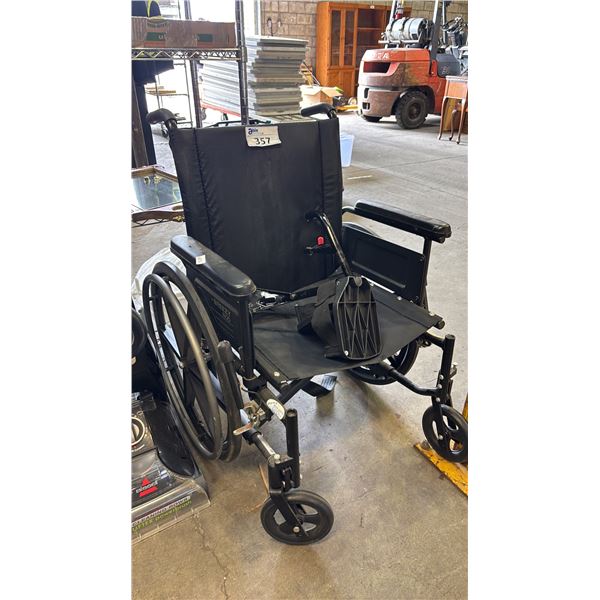 WHEEL CHAIR WITH FOOT RESTS *STICKY HANDLES/MISSING PIECE TO ATTACH FOOT RESTS*