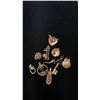 Image 1 : TEN APPROX 10K+ CHARMS (14.6G)