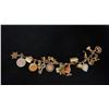 Image 1 : APPROX 14K CHARM BRACELET (7") WITH ASSORTED APPROX 9K-14K CHARMS (32.5G)