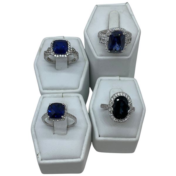 4 Deep Blue & Clear Crystal Rings Stamped .925 - Appear to be new - Widest ring face is 18mm * Total