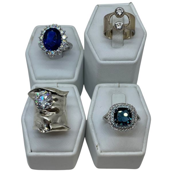 4 CZ, Blue Topaz & Clear Crystal Rings Stamped .925 - Widest ring face is 25 mm * Total weight: 26 g
