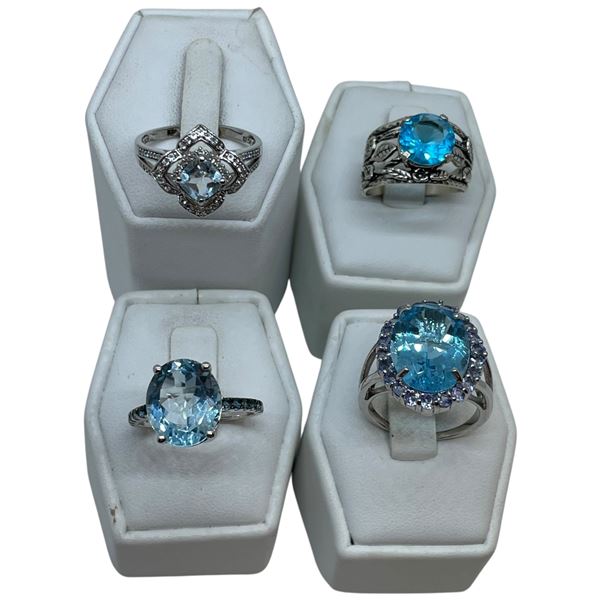 4 Blue Topaz Crystal Ring Stamped .925 - Widest ring face is 21 mm * Total weight: 21 grams